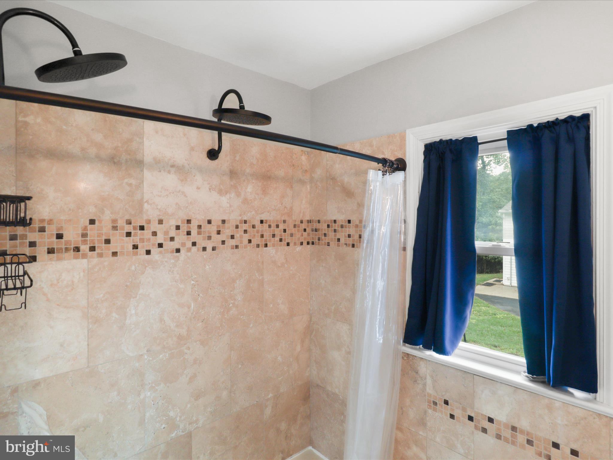 7533 Hollindale Court Alexandria, VA 22306 - Photo 25 of 78 a bathroom with a shower and a sink