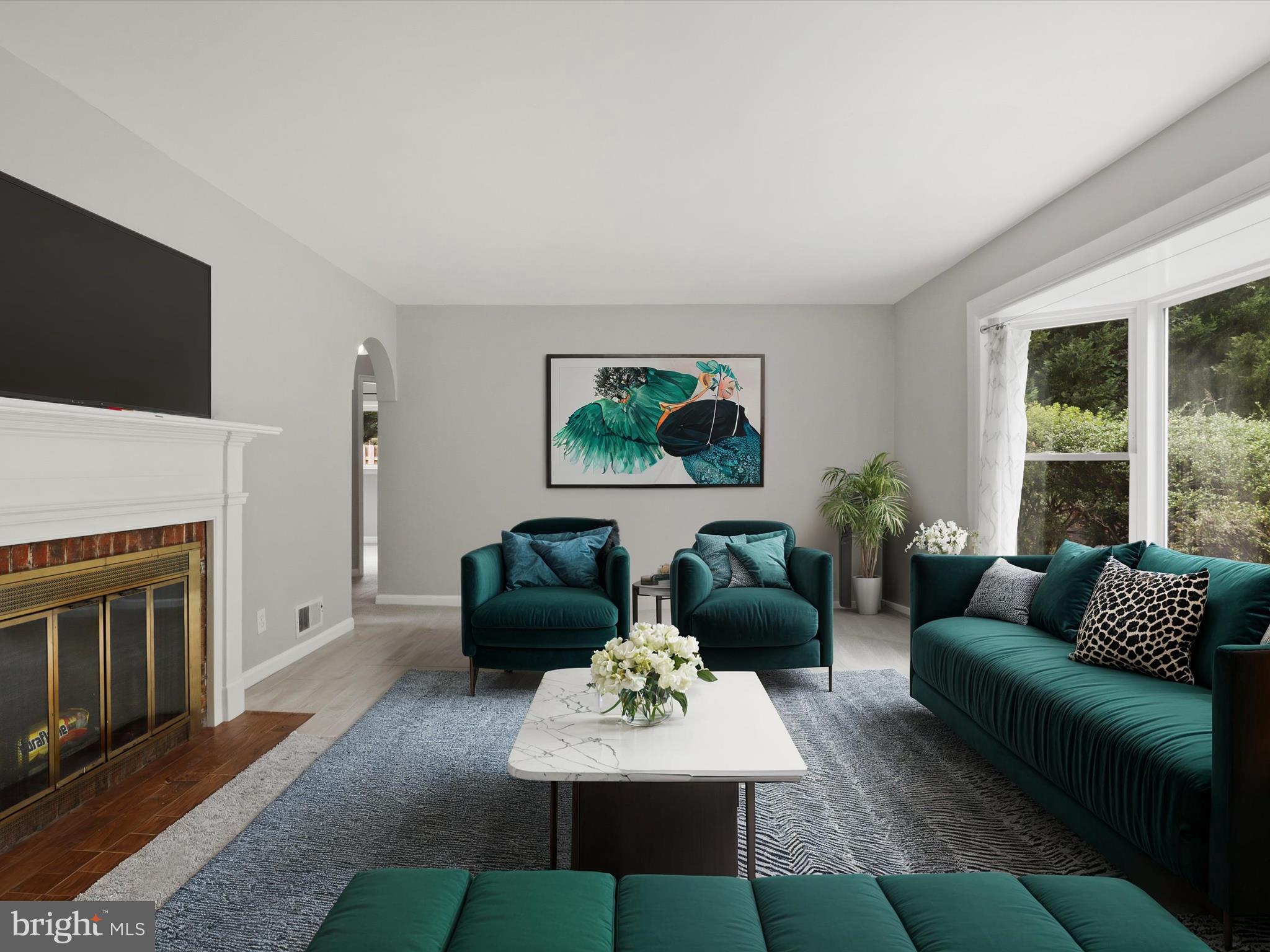 7533 Hollindale Court Alexandria, VA 22306 - Photo 3 of 78 a living room with furniture a fireplace and a flat screen tv