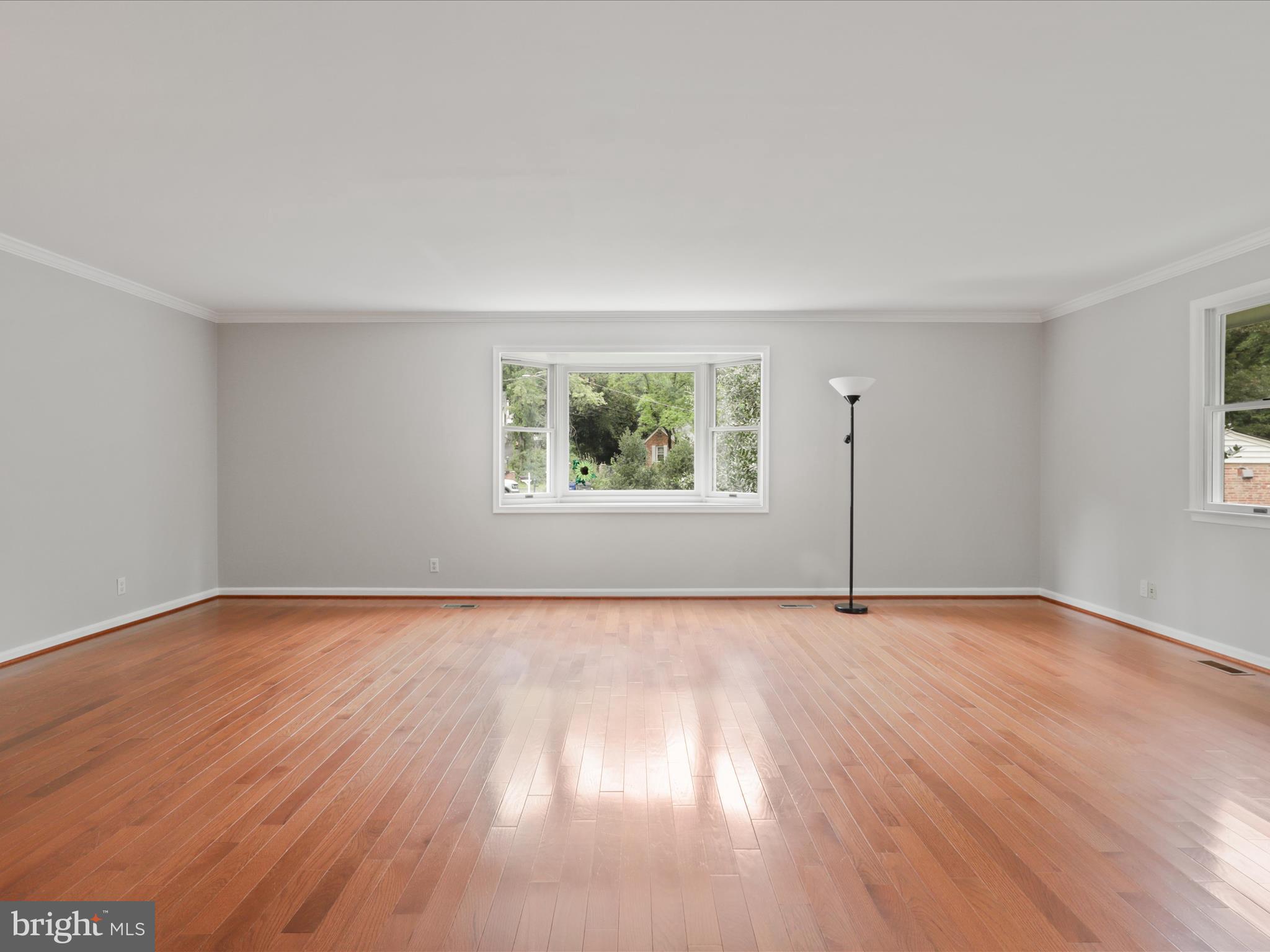 7533 Hollindale Court Alexandria, VA 22306 - Photo 35 of 78 an empty room with wooden floor and windows