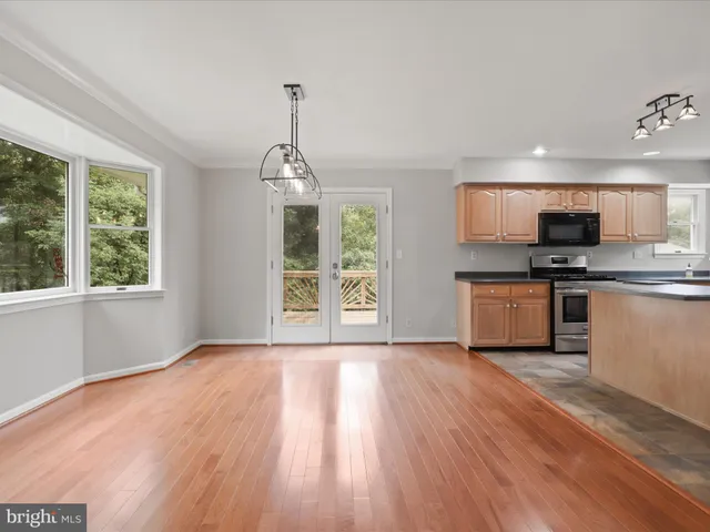 a view of a kitchen with a sink and a stove top oven