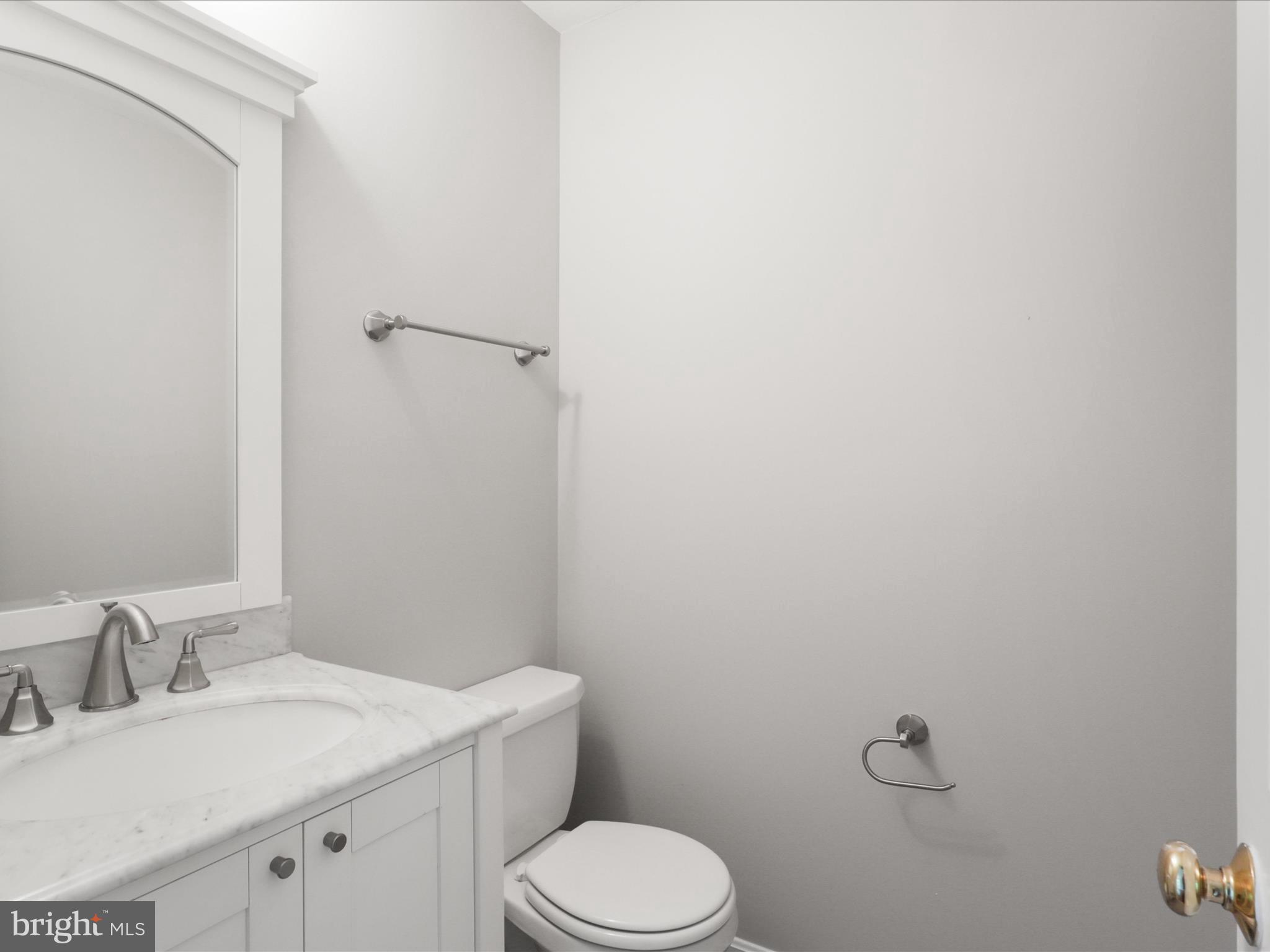 7533 Hollindale Court Alexandria, VA 22306 - Photo 41 of 78 a bathroom with a granite countertop toilet and sink