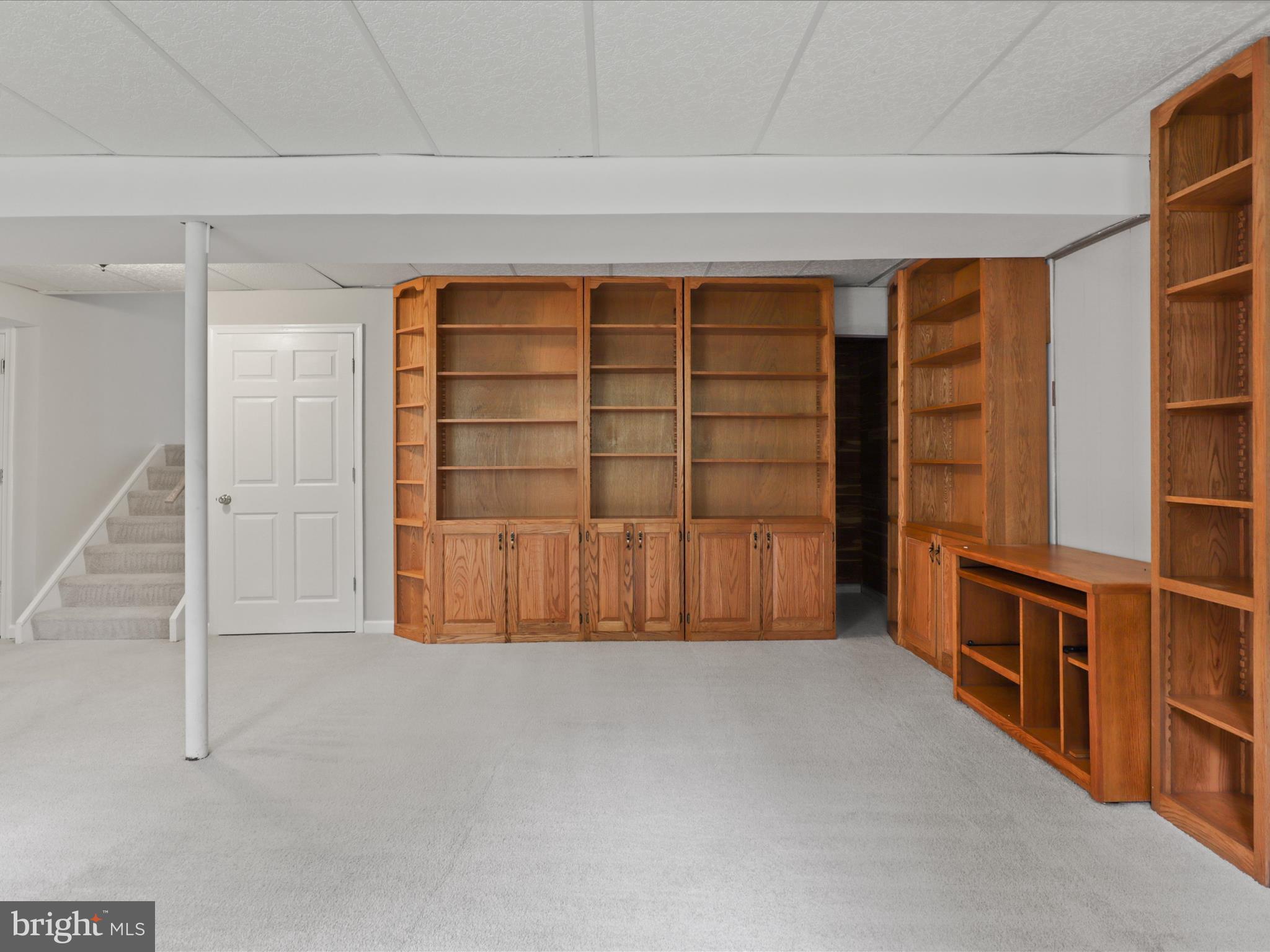 7533 Hollindale Court Alexandria, VA 22306 - Photo 48 of 78 a view of an empty room with wooden shelves