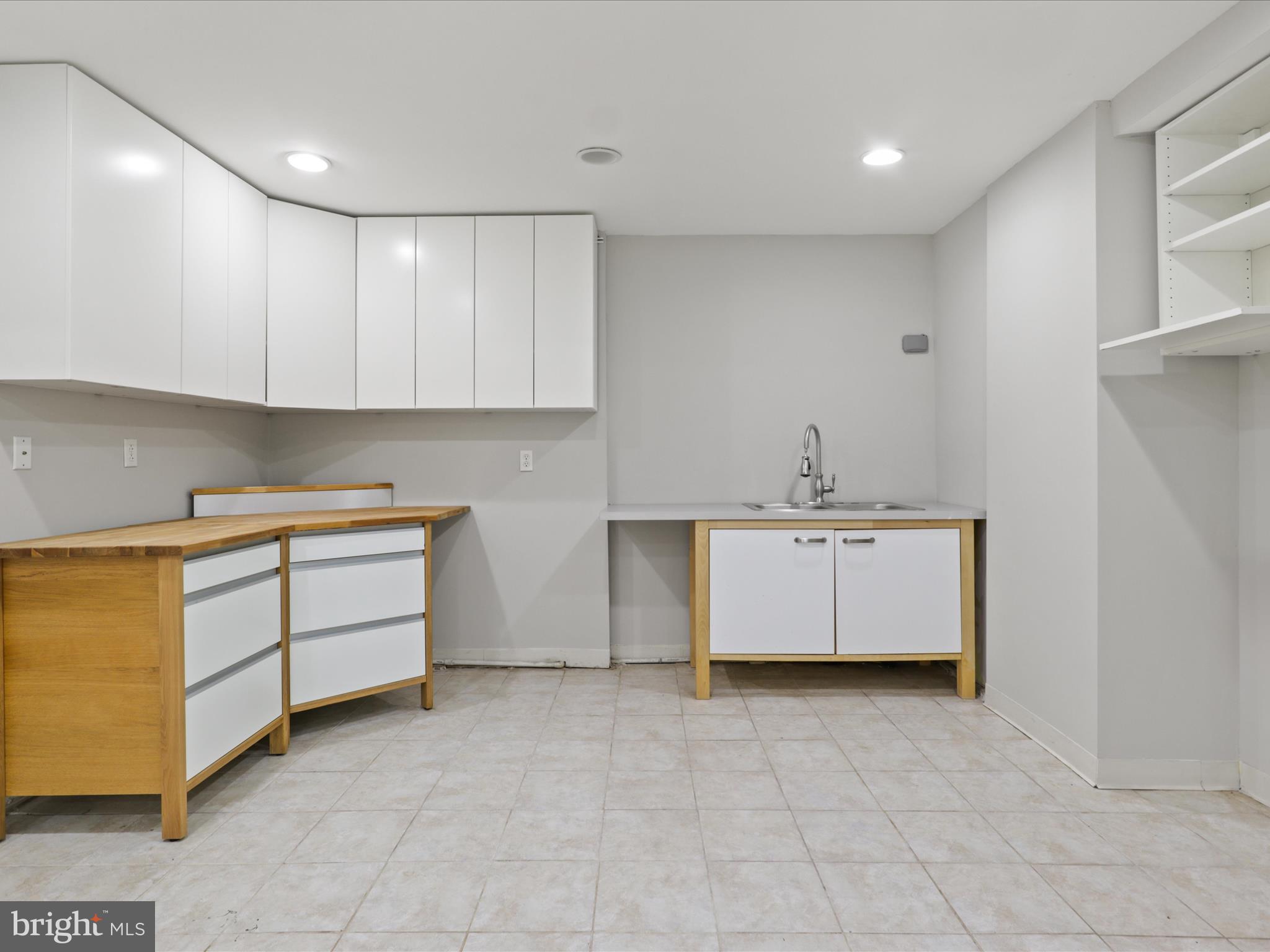 7533 Hollindale Court Alexandria, VA 22306 - Photo 52 of 78 a view of a kitchen with a sink and a stove top oven