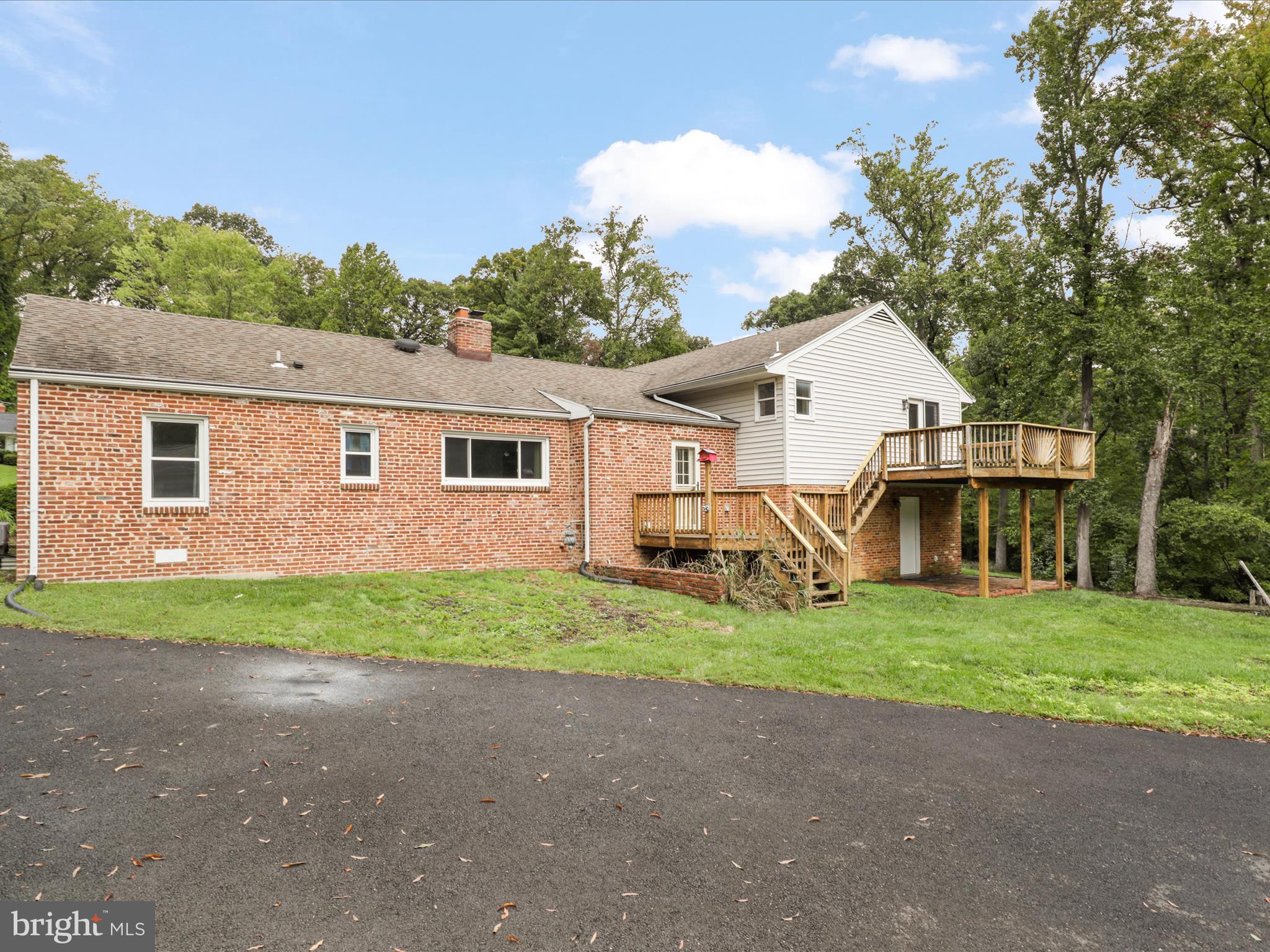7533 Hollindale Court Alexandria, VA 22306 - Photo 54 of 78 a view of a house with a yard and large trees