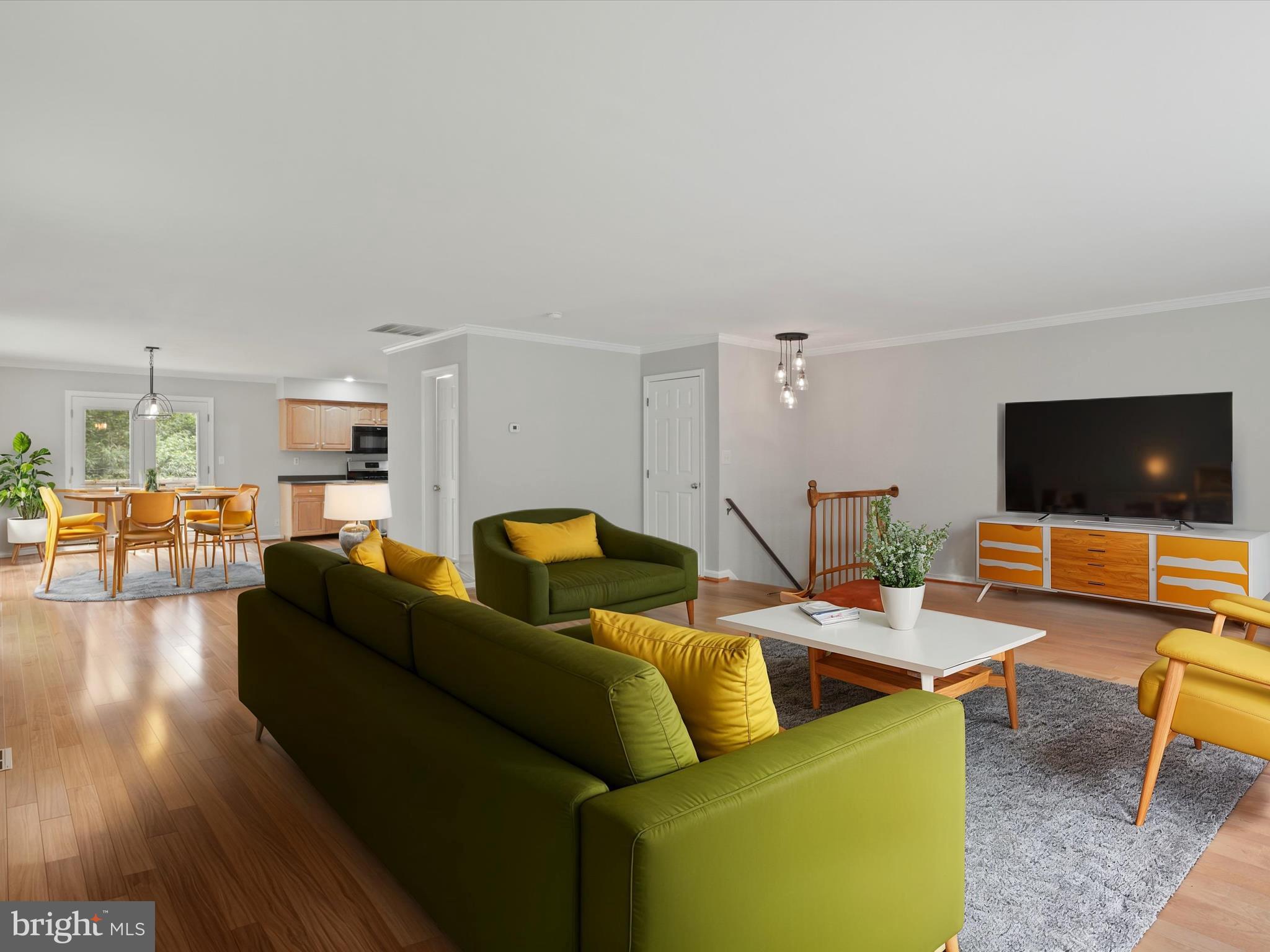 7533 Hollindale Court Alexandria, VA 22306 - Photo 6 of 78 a living room with furniture and a flat screen tv