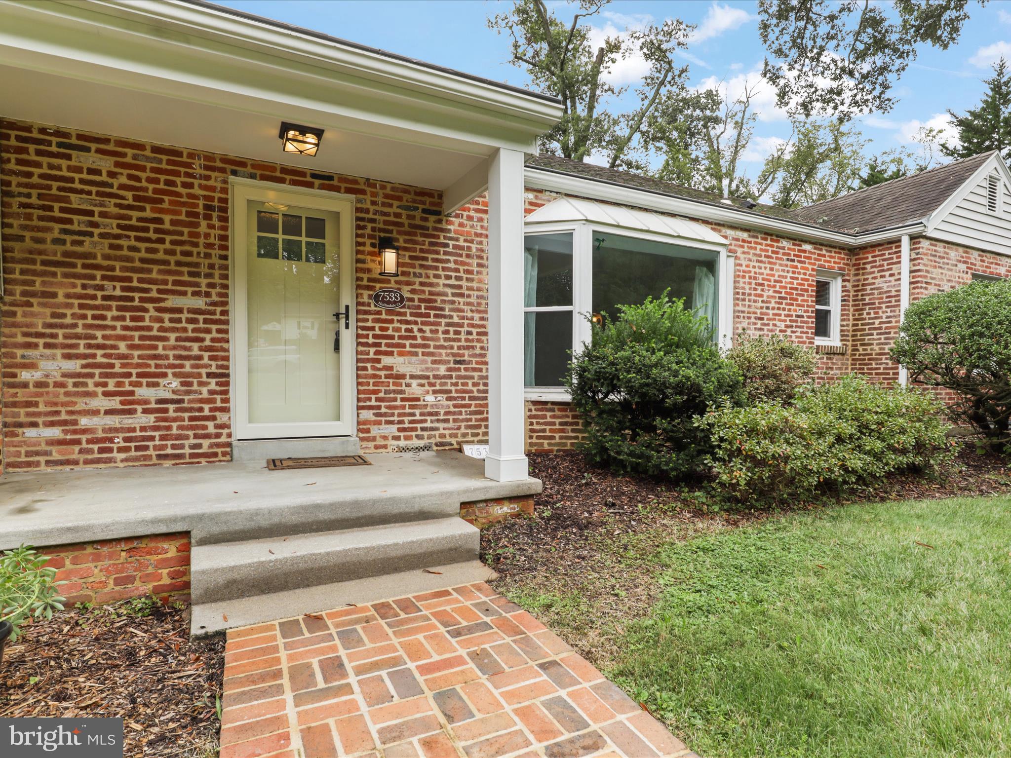 7533 Hollindale Court Alexandria, VA 22306 - Photo 8 of 78 a front view of a house with garden