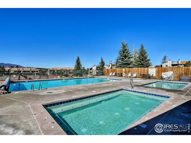 a view of a swimming pool with an outdoor seating