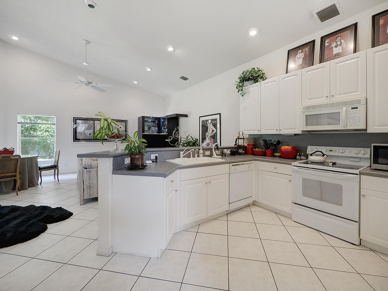 7044 Falls Road East Boynton Beach, FL 33437 - Photo 11 of 22 Kitchen to Family Room