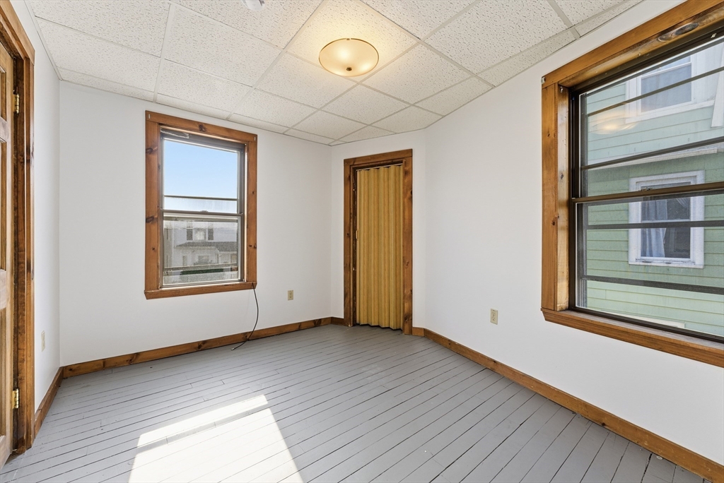 287 East Street Ludlow, MA 01056 - Photo 15 of 42 a view of an empty room with wooden floor and a window