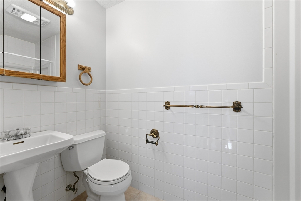 287 East Street Ludlow, MA 01056 - Photo 16 of 42 a bathroom with a toilet sink and mirror