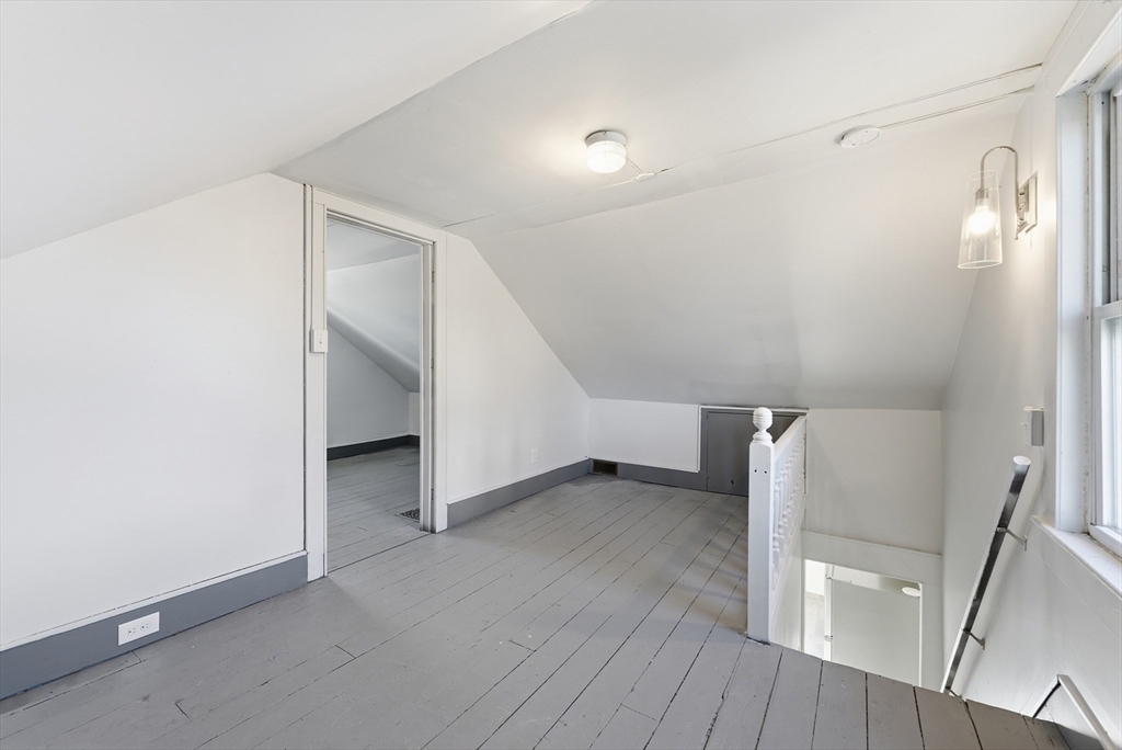287 East Street Ludlow, MA 01056 - Photo 25 of 42 a view of an empty room with wooden floor and a window