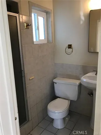 a bathroom with a toilet and a sink
