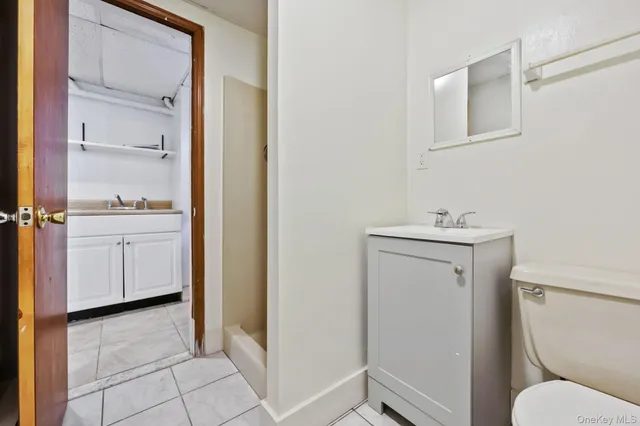 a bathroom with a sink toilet and vanity