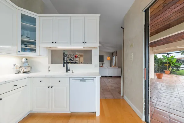 a kitchen with a sink and cabinets