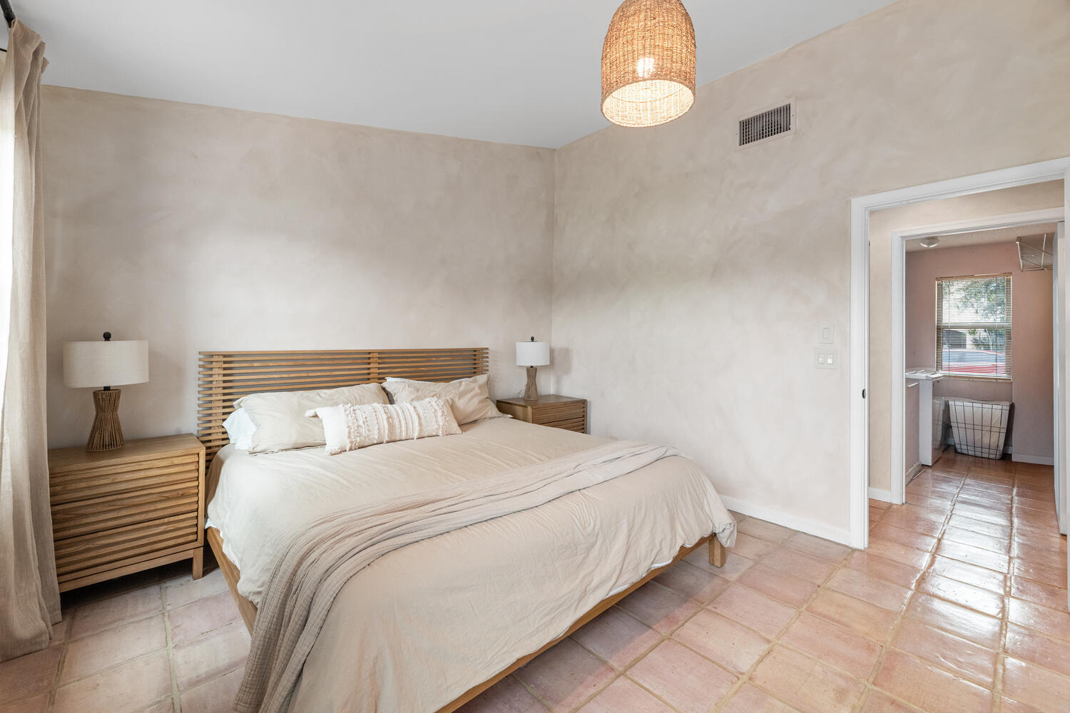 12541 Shoreside Lane Wellington, FL 33414 - Photo 17 of 39 a bedroom with a bed and a chandelier