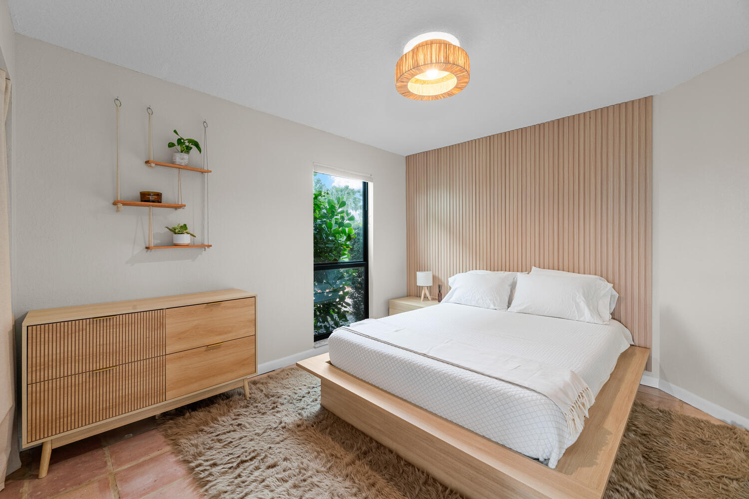 12541 Shoreside Lane Wellington, FL 33414 - Photo 20 of 39 a bedroom with a bed and a window