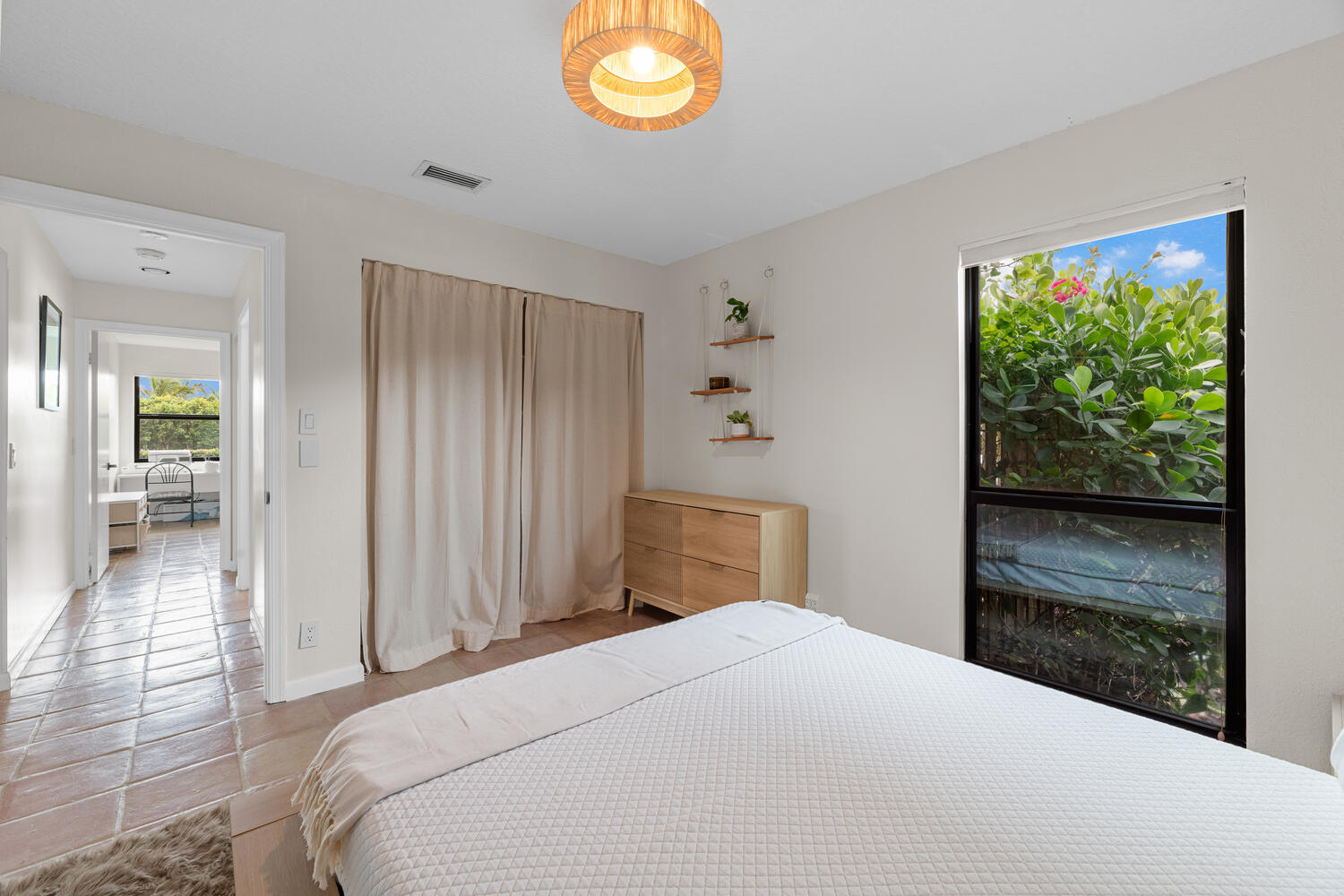 12541 Shoreside Lane Wellington, FL 33414 - Photo 22 of 39 a bedroom with a bed and a window