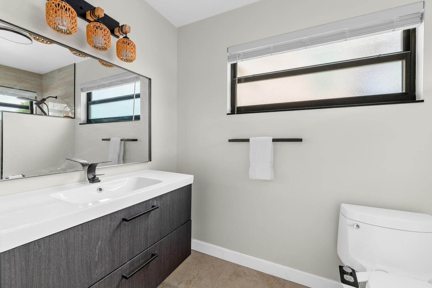 12541 Shoreside Lane Wellington, FL 33414 - Photo 27 of 39 a bathroom with a sink and a mirror