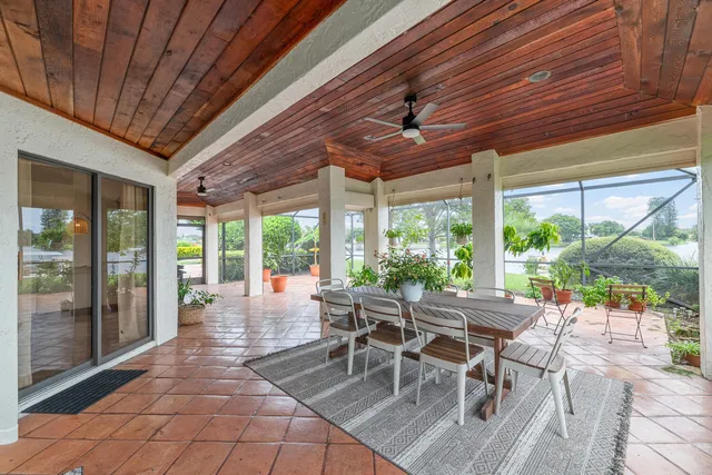 a building outdoor space with patio furniture and garden view