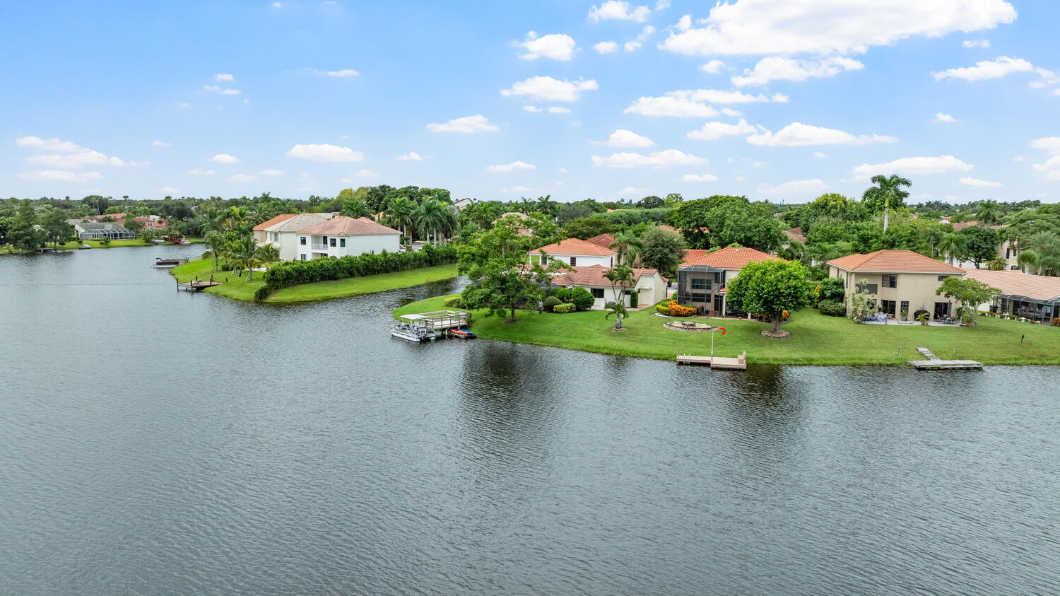 12541 Shoreside Lane Wellington, FL 33414 - Photo 32 of 39 a view of a lake with houses