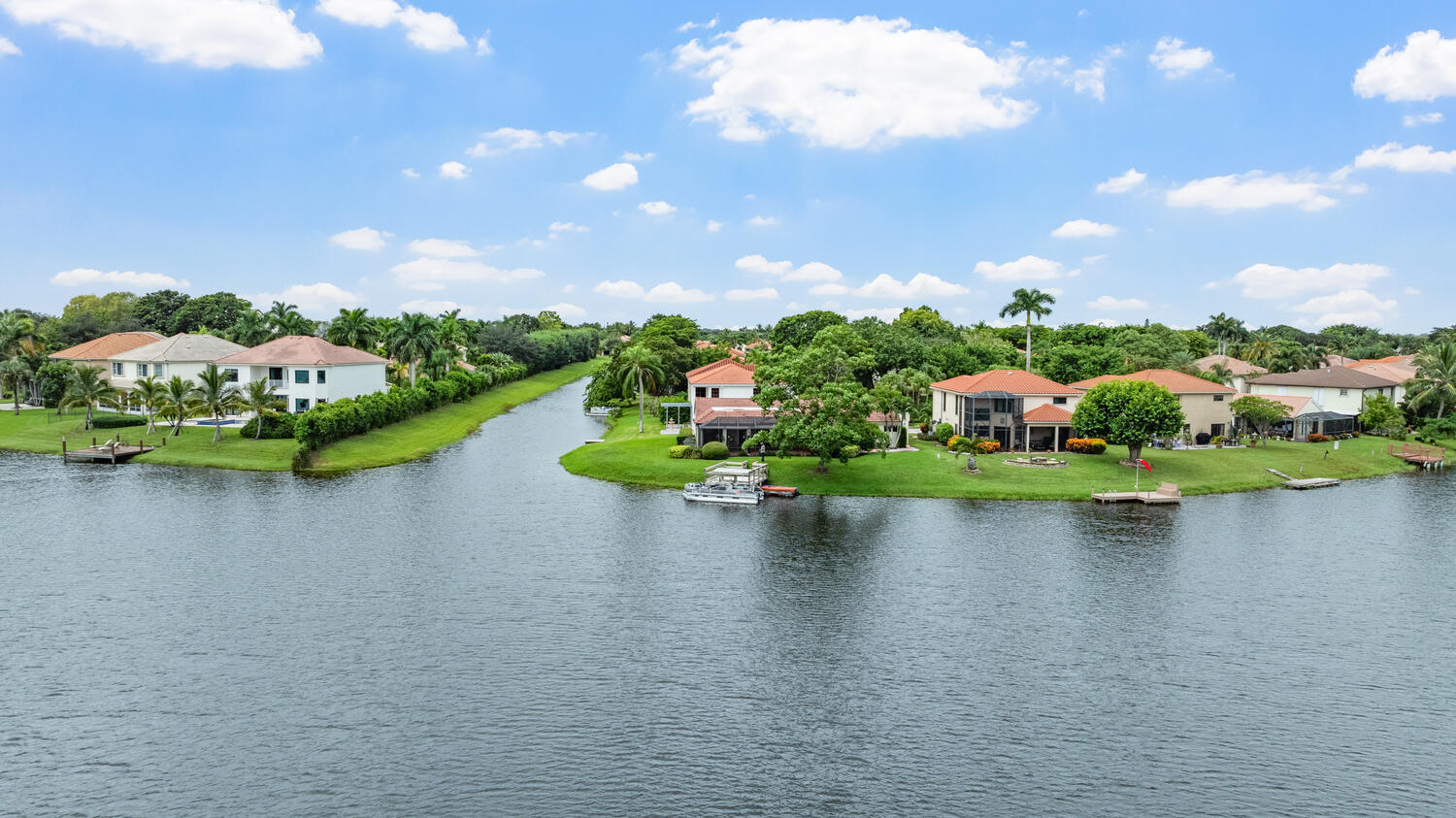 12541 Shoreside Lane Wellington, FL 33414 - Photo 33 of 39 a view of a lake with a houses