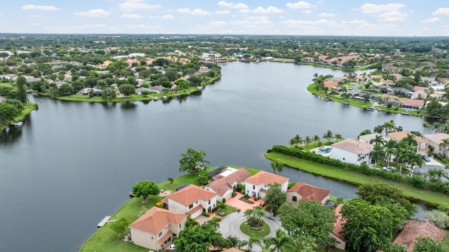 12541 Shoreside Lane Wellington, FL 33414 - Photo 34 of 39 an aerial view of a house with a lake view