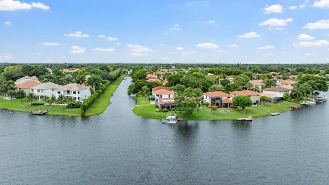 a view of a lake from a floor to ceiling window