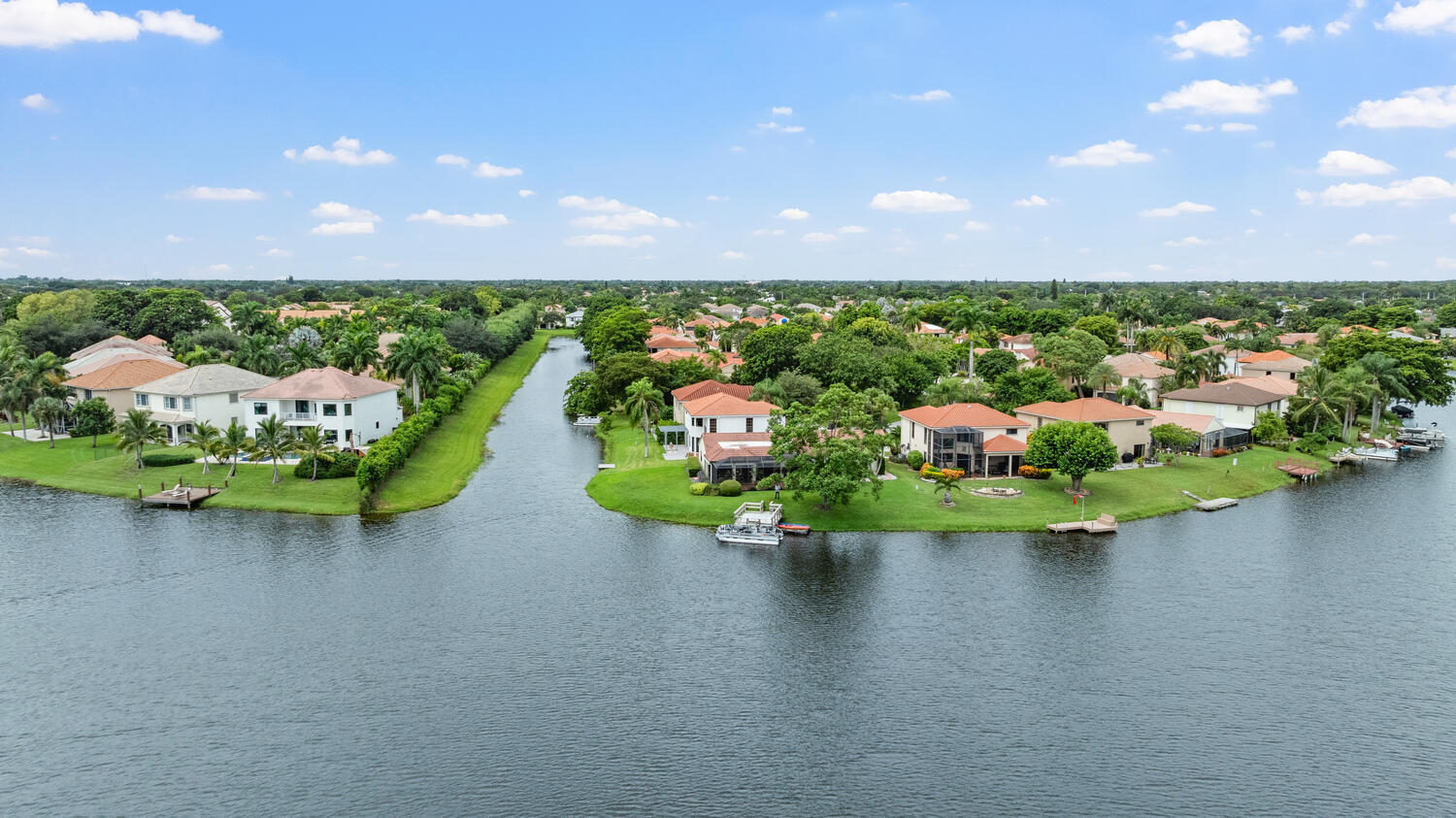 12541 Shoreside Lane Wellington, FL 33414 - Photo 36 of 39 a view of a lake from a floor to ceiling window