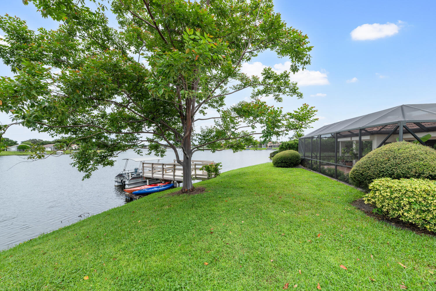 12541 Shoreside Lane Wellington, FL 33414 - Photo 37 of 39 a view of a house with backyard and a tree