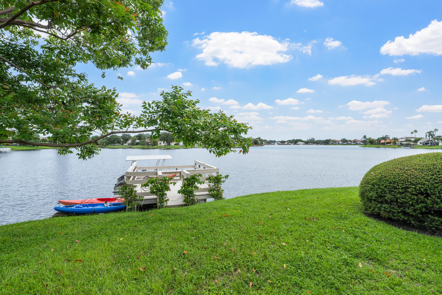 12541 Shoreside Lane Wellington, FL 33414 - Photo 38 of 39 a green field with flowers in it