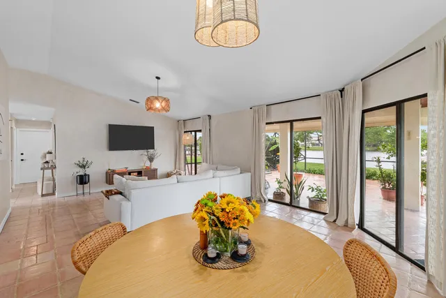 a living room with fireplace furniture and a flat screen tv