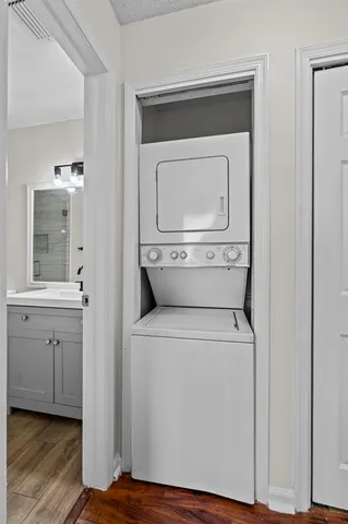 a utility room with dryer washer and a sink