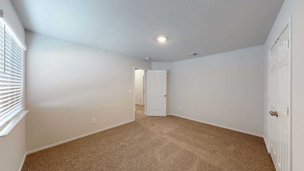 300 Creekfall Road Burnet, TX 78611 - Photo 16 of 23 an empty room with windows