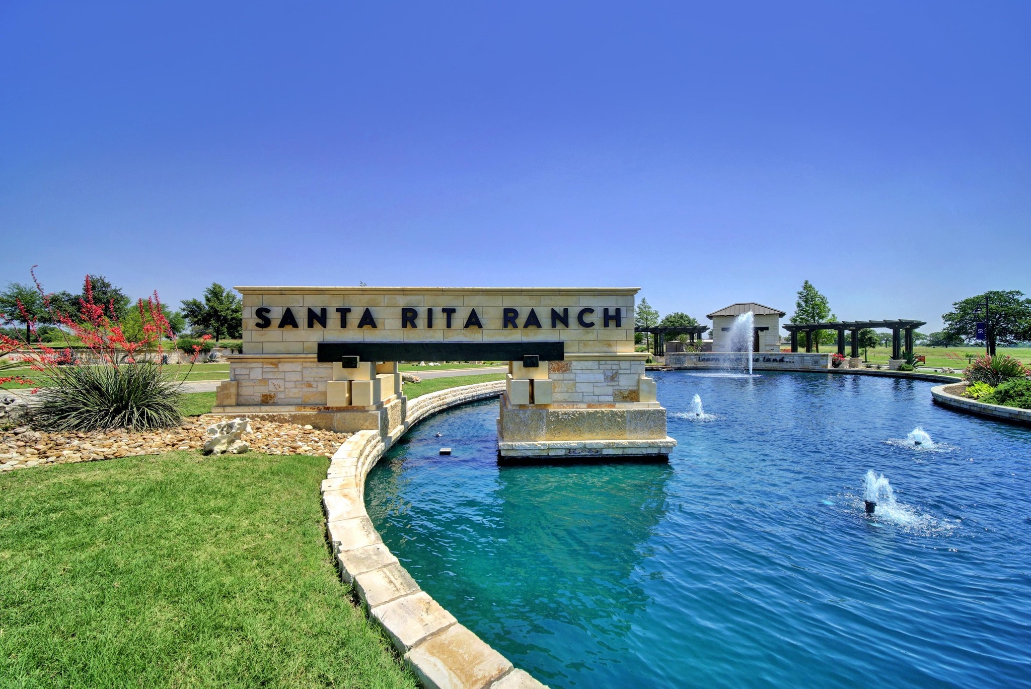 108 Leon Loop Liberty Hill, TX 78642 - Photo 33 of 39 Swimming pool featuring a lawn and a water view