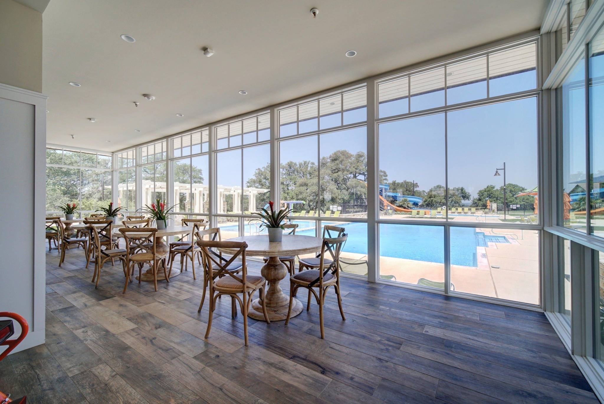 108 Leon Loop Liberty Hill, TX 78642 - Photo 35 of 39 Dining space with floor to ceiling windows, dark wood-type flooring, and recessed lighting