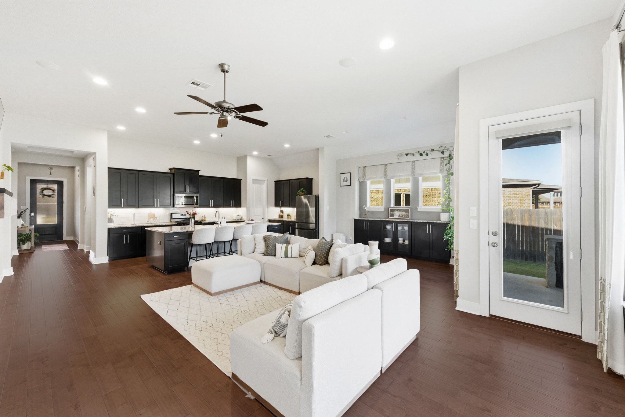 108 Leon Loop Liberty Hill, TX 78642 - Photo 6 of 39 Living room with dark wood-type flooring, ceiling fan, and recessed lighting