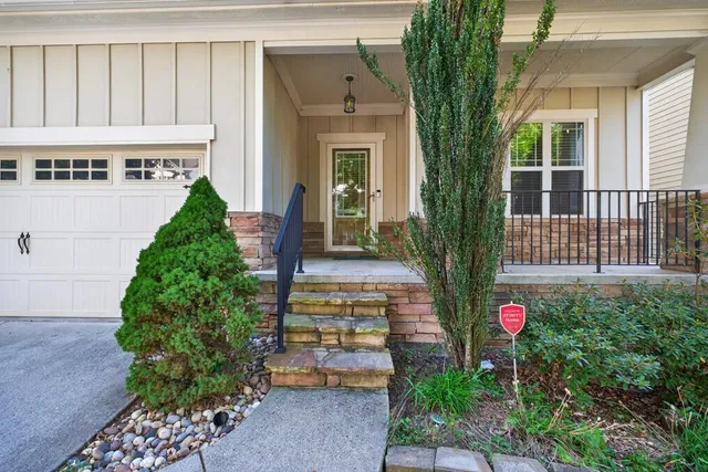 a front view of a house with garden