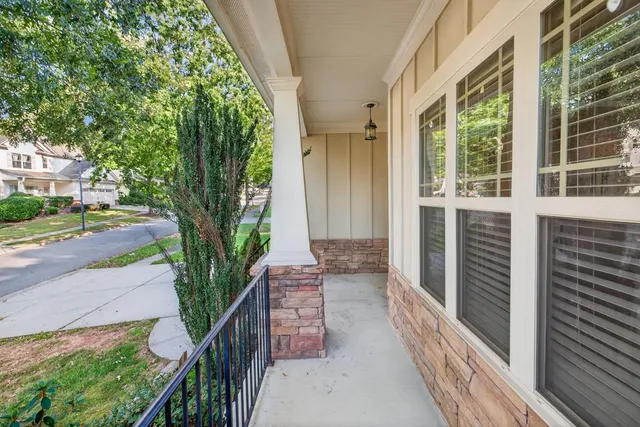 a view of a house with a tree in front