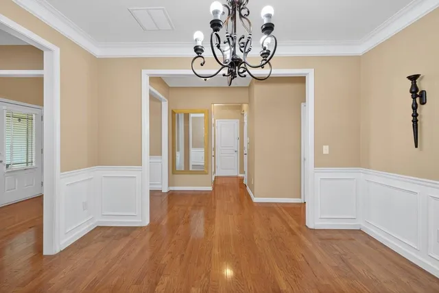 a view of an entryway with wooden floor