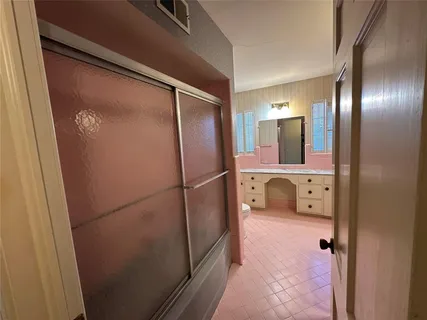 a bathroom with a double vanity sink and mirror