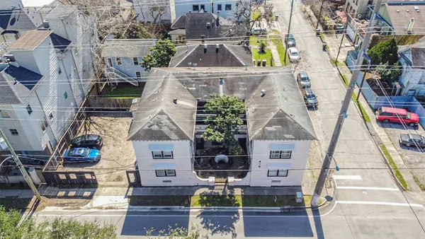 an aerial view of a house with a ocean view