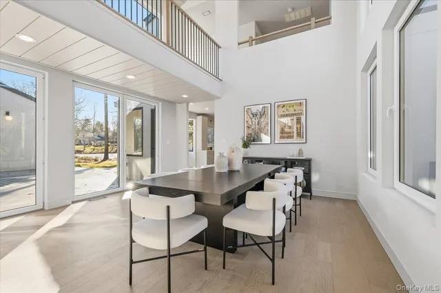 a view of a dining room with furniture and a large window