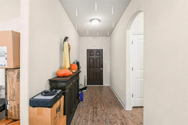 a view of room with furniture and a chandelier