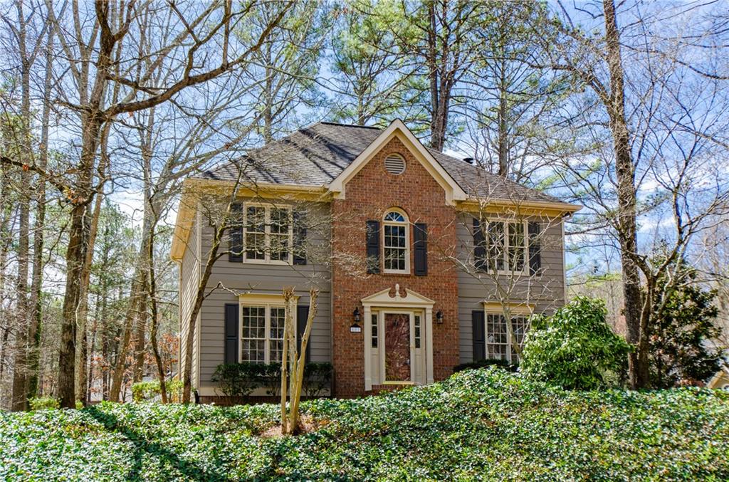 front view of a house with a garden