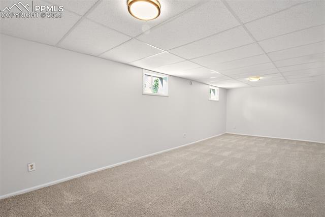 130 South Chelton Road Colorado Springs, CO 80910 - Photo 14 of 17 Basement with carpet floors and a drop ceiling