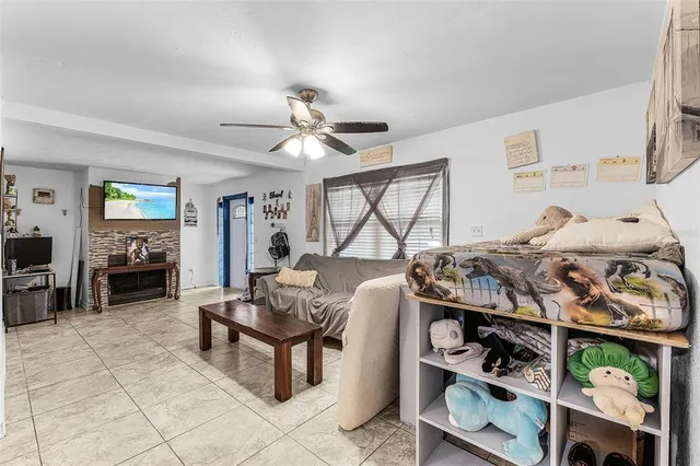 a bedroom with furniture and a window