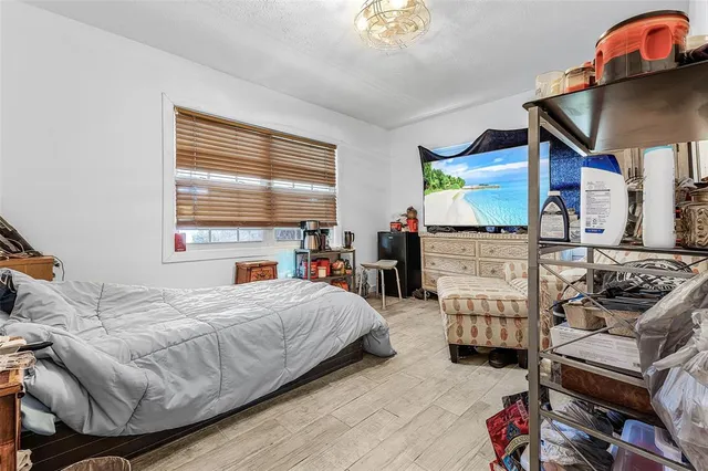 a bedroom with a bed and a couch