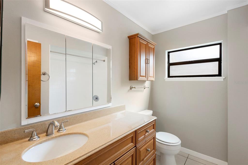 286 Valencia Road DeBary, FL 32713 - Photo 21 of 38 a bathroom with a sink toilet and vanity