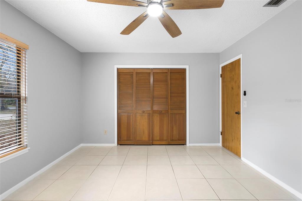 286 Valencia Road DeBary, FL 32713 - Photo 25 of 38 a view of an empty room with a window