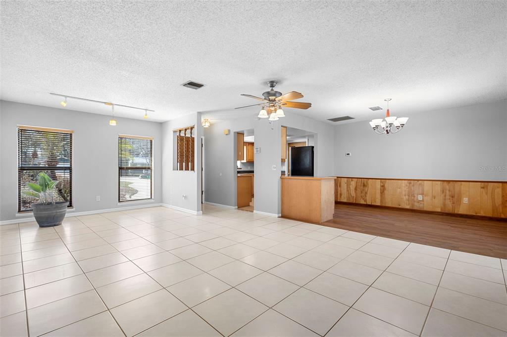 286 Valencia Road DeBary, FL 32713 - Photo 4 of 38 a view of a kitchen with cabinet and refrigerator